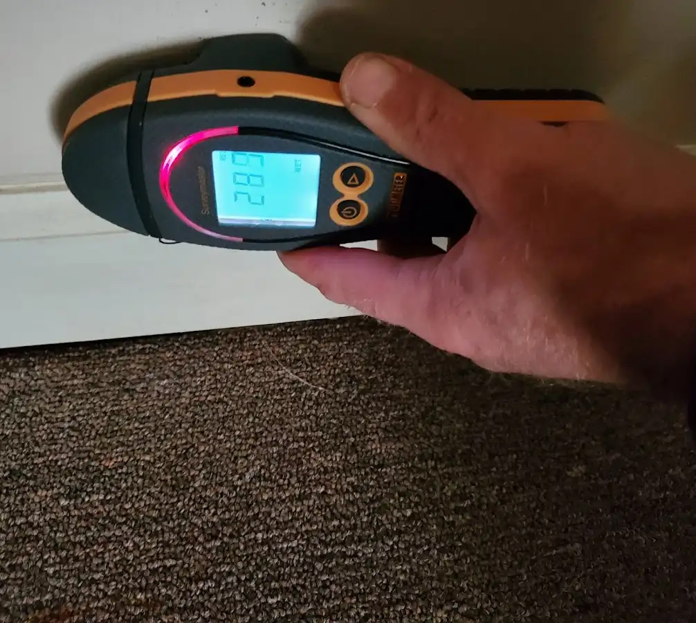Moisture detection at baseboard during Storm Damage Restoration in Rostraver